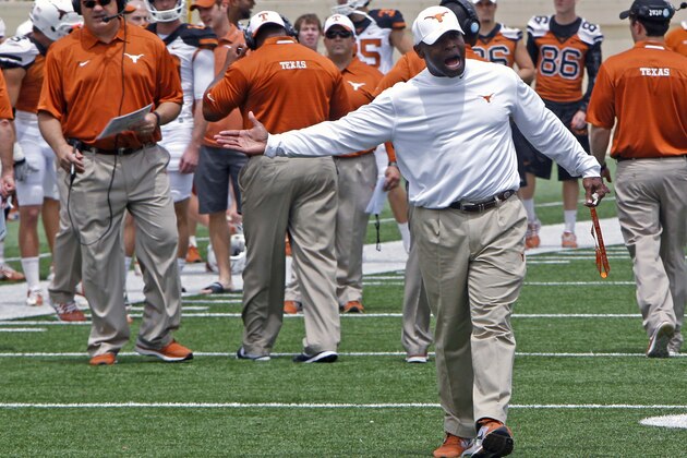 Texas coach Charlie Strong calls out to his players during the first half of the team's Orange and White spring NCAA college football game, Saturday, April 19, 2014, in Austin, Texas.  (AP Photo/Michael Thomas)