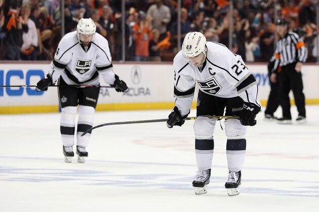 ANAHEIM, CA - MAY 12:  Justin Williams (L) #14 and Dustin Brown #23 of the Los Angeles Kings look down following the Kings' 3-4 loss to the Anaheim Ducks in Game Five of the Second Round of the 2014 NHL Stanley Cup Playoffs at Honda Center on May 12, 2014 in Anaheim, California.  (Photo by Jeff Gross/Getty Images)