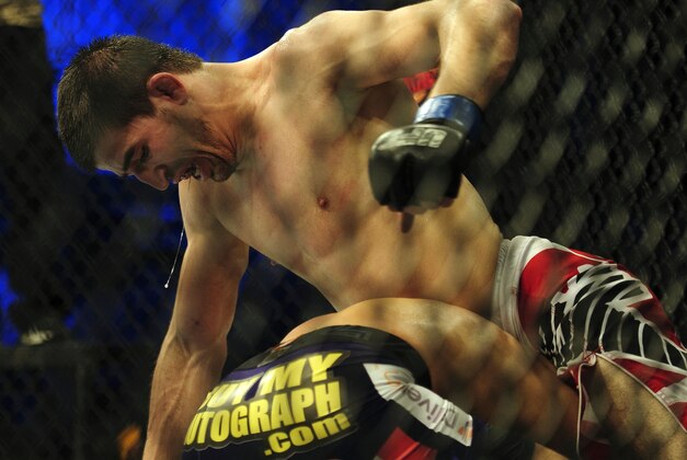 Nov 6, 2013; Fort Campbell, KY, USA; Jorge Masvidal (red gloves) fights Rustam Khabilov (blue gloves) in the lightweight bout during UFC Fight for the Troops at Fort Campbell. Mandatory Credit: Joshua Lindsey-USA TODAY Sports