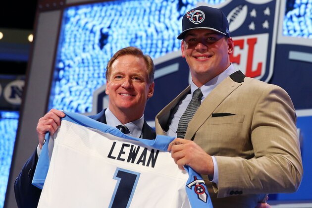 NEW YORK, NY - MAY 08:  Taylor Lewan of the Michigan Wolverines poses with NFL Commissioner Roger Goodell after he was picked #11 overall by the during the first round of the 2014 NFL Draft at Radio City Music Hall on May 8, 2014 in New York City.  (Photo by Elsa/Getty Images)