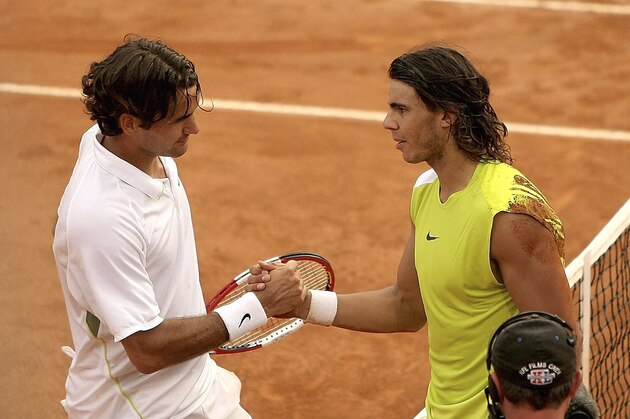 ROME - MAY 14:  Rafael Nadal of Spain shakes hands with Roger Federer of Switzerland, at the net, after defeating him in the final of the ATP Masters Series on May 14, 2006 at the Foro Italico in Rome, Italy.  (Photo by Clive Brunskill/Getty Images)