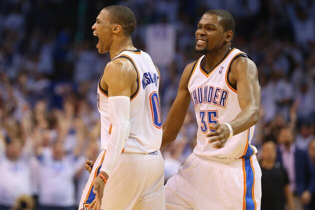 OKLAHOMA CITY, OK - MAY 13:  (L-R) Russell Westbrook #0 and Kevin Durant celebrate a 105-104 win against the Los Angeles Clippers in Game Five of the Western Conference Semifinals during the 2014 NBA Playoffs at Chesapeake Energy Arena on May 13, 2014 in Oklahoma City, Oklahoma. NOTE TO USER: User expressly acknowledges and agrees that, by downloading and or using this photograph, User is consenting to the terms and conditions of the Getty Images License Agreement.  (Photo by Ronald Martinez/Getty Images)
