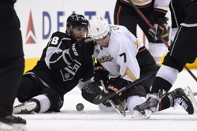 Los Angeles Kings center Jarret Stoll, left, and Anaheim Ducks center Andrew Cogliano battle for the puck during the third period in Game 4 of an NHL hockey second-round Stanley Cup playoff series, Saturday, May 10, 2014, in Los Angeles. The Duck won 2-0. (AP Photo/Mark J. Terrill) Los Angeles Kings center Jarret Stoll, left, and Anaheim Ducks center Andrew Cogliano battle for the puck during the third period in Game 4 of an NHL hockey second-round Stanley Cup playoff series, Saturday, May 10, 2014, in Los Angeles. The Duck won 2-0. (AP Photo/Mark J. Terrill)