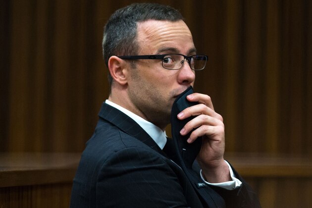 Oscar Pistorius, gestures, as he listens to psychiatric evidence for his defense, during his ongoing murder trial in Pretoria, South Africa, Tuesday, May 13, 2014. The chief prosecutor in the murder trial of Oscar Pistorius has asked that the double-amputee runner be placed under psychiatric evaluation after an expert witness testified that he had an anxiety disorder.  Pistorius is charged with the shooting death of his girlfriend Reeva Steenkamp on Valentine's Day in 2013. (AP Photo/Daniel Born, Pool)