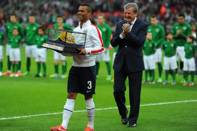 LONDON, ENGLAND - MAY 29:  Captain Ashley Cole of England is honoured with his 100th cap as Roy Hodgson manager of England looks on prior to the International Friendly match between England and the Republic of Ireland at Wembley Stadium on May 29, 2013 in London, England.  (Photo by Mike Hewitt/Getty Images)