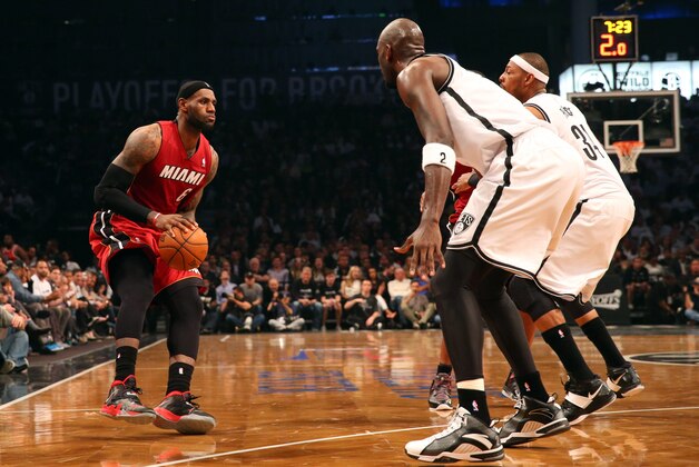 May 12, 2014; Brooklyn, NY, USA;  Miami Heat forward LeBron James (6) looks to drive around Brooklyn Nets defense during the second quarter in game four of the second round of the 2014 NBA Playoffs at Barclays Center. Mandatory Credit: Anthony Gruppuso-USA TODAY Sports