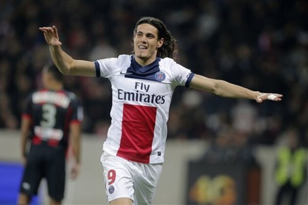 CORRECTING SCORER - Paris Saint Germain's Edinson Cavani of Uruguay, reacts after an own goal by Nice player Timothee Kolodziejczak, during their French League One soccer match, in Nice stadium, southeastern France, Friday, March 28, 2014. Kolodziejczak tried to intercept Cavani but only succeeded in flicking the ball into his own net. (AP Photo/Lionel Cironneau)