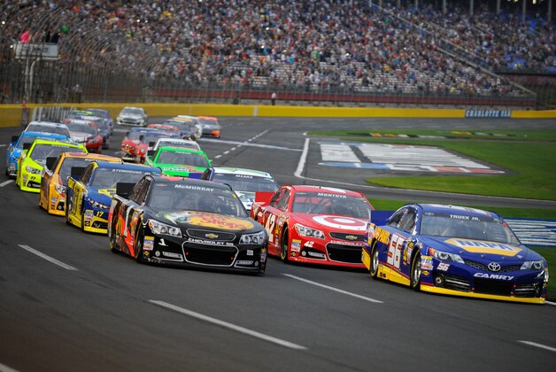 CONCORD, NC - MAY 18:  Jamie McMurray, driver of the #1 Bass Pro Shops/National Wild Turkey Foundation Chevrolet, and Martin Truex Jr., driver of the #56 NAPA Auto Parts Toyota, lead the field during the NASCAR Sprint Cup Showdown at Charlotte Motor Speedway on May 18, 2013 in Concord, North Carolina.  (Photo by Jared C. Tilton/Getty Images)