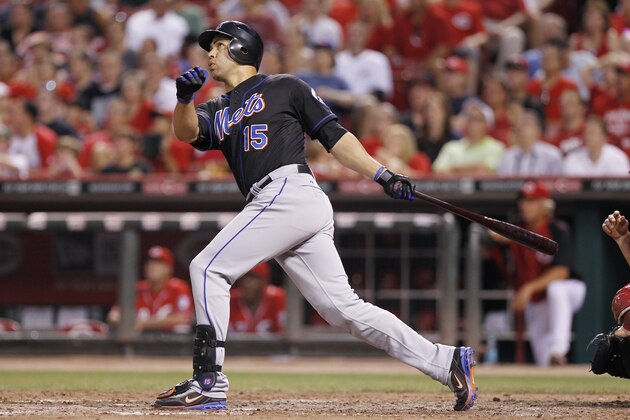 CINCINNATI, OH - JULY 25: Carlos Beltran #15 of the New York Mets drives in the game-tying run in the seventh inning with a sacrifice fly against the Cincinnati Reds at Great American Ball Park on July 25, 2011 in Cincinnati, Ohio. (Photo by Joe Robbins/Getty Images)