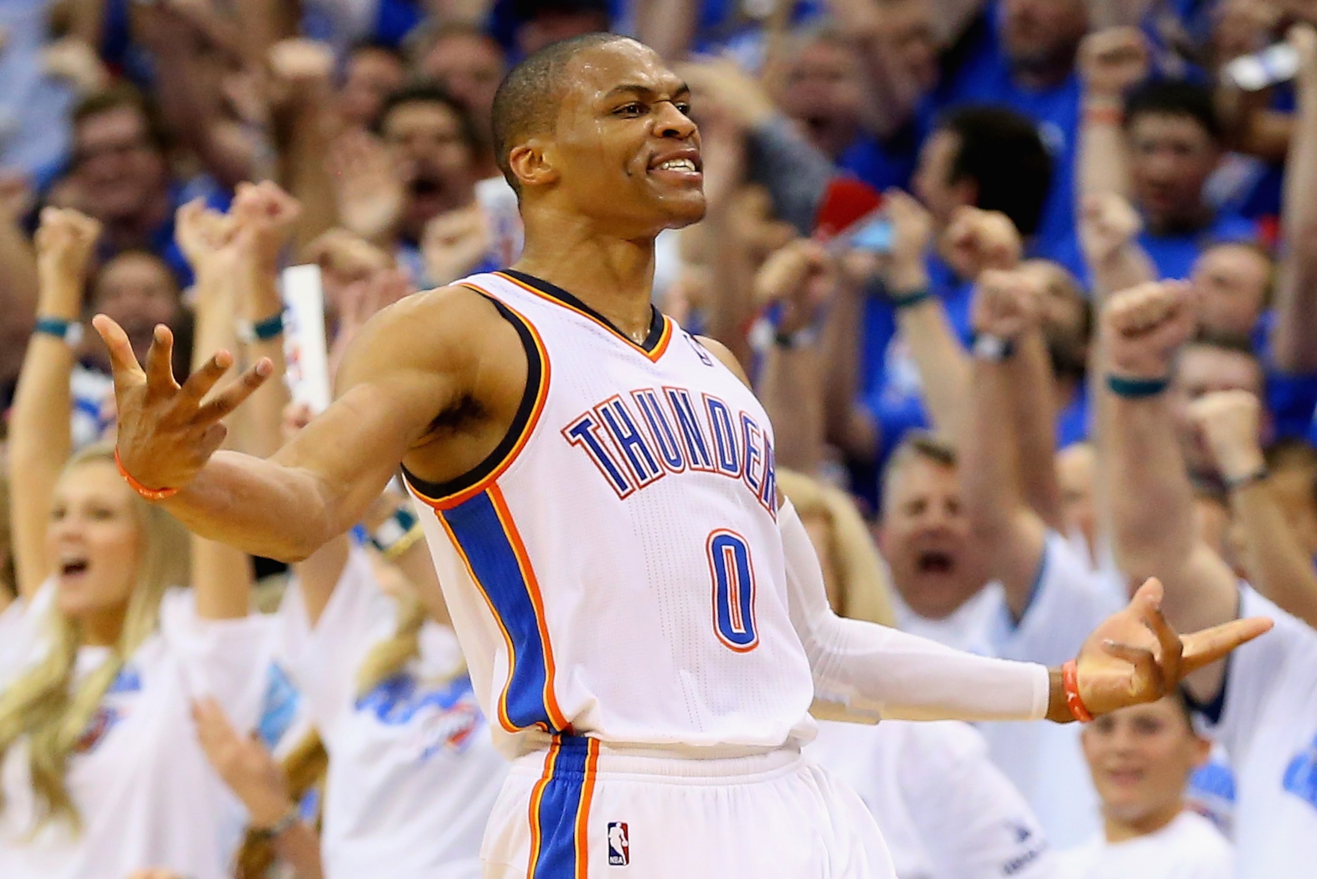 OKLAHOMA CITY, OK - MAY 07:  Russell Westbrook #0 of the Oklahoma City Thunder celebrates a three-point shot against the Los Angeles Clippers in Game Two of the Western Conference Semifinals during the 2014 NBA Playoffs at Chesapeake Energy Arena on May 7, 2014 in Oklahoma City, Oklahoma. NOTE TO USER: User expressly acknowledges and agrees that, by downloading and or using this photograph, User is consenting to the terms and conditions of the Getty Images License Agreement.  (Photo by Ronald Martinez/Getty Images)