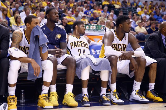 INDIANAPOLIS, IN - MAY 13:  George Hill #3, Lance Stephenson #1, Paul George #24 and Roy Hibbert #55 of the Indiana Pacers watch from the bench in the fourth quater of the 102-79 loss to the Washington Wizards in Game 5 of the Eastern Conference Semifinals during the 2014 NBA Playoffs at Bankers Life Fieldhouse on May 13, 2014 in Indianapolis, Indiana. NOTE TO USER: User expressly acknowledges and agrees that, by downloading and or using this photograph, User is consenting to the terms and conditions of the Getty Images License Agreement.  (Photo by Andy Lyons/Getty Images)