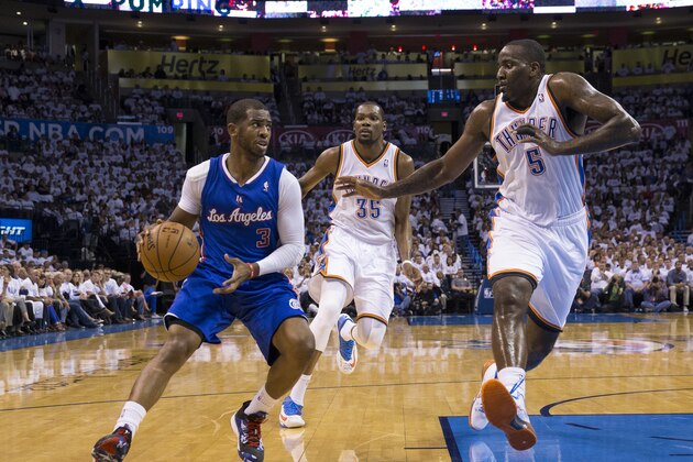 OKLAHOMA CITY, OK - May 13: Chris Paul #3 of the Los Angeles Clippers dribbles the ball against Kendrick Perkins #5 of the Oklahoma City Thunder in Game 5 of the Western Conference Semifinals during the 2014 NBA Playoffs at the Chesapeake Arena on May 13, 2014 in Oklahoma City, Oklahoma. NOTE TO USER:  User expressly acknowledges and agrees that, by downloading and/or using this photograph, user is consenting to the terms and conditions of the Getty Images License Agreement. Mandatory Copyright Notice:  Copyright 2014 NBAE (Photo by Richard Rowe/NBAE via Getty Images)