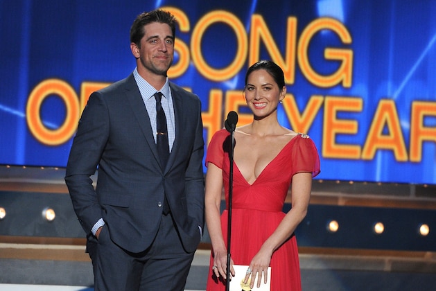 Aaron Rodgers, left, and Olivia Munn speak on stage at the 49th annual Academy of Country Music Awards at the MGM Grand Garden Arena on Sunday, April 6, 2014, in Las Vegas. (Photo by Chris Pizzello/Invision/AP)