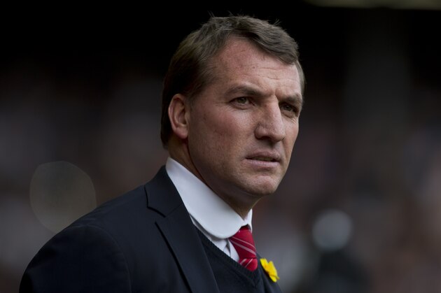 Liverpool's manager Brendan Rodgers takes to the touchline before his team's English Premier League soccer match against Tottenham at Anfield Stadium, Liverpool, England, Sunday March 30, 2014. (AP Photo/Jon Super)