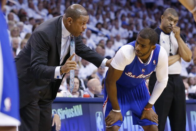 Los Angeles Clippers coach Doc Rivers, left, talks to guard Chris Paul in the first quarter of Game 5 of the Western Conference semifinal NBA basketball playoff series against the Oklahoma City Thunder, in Oklahoma City, Tuesday, May 13, 2014. (AP Photo)