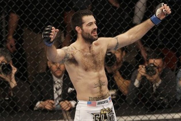 Matt Brown celebrates after beating Mike Swick during a welterweight mixed martial arts bout at a UFC on Fox event in Seattle, Saturday, Dec. 8, 2012. Brown won by knockout in the second round. (AP Photo/Jeff Chiu)