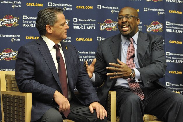 Apr 24, 2013; Independence, OH, USA; New Cleveland Cavaliers head coach Mike Brown (right) talks beside team owner Dan Gilbert during a press conference at Cleveland Clinic Courts. Mandatory Credit: David Richard-USA TODAY Sports