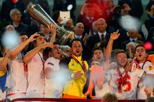 TURIN, ITALY - MAY 14:  Ivan Rakitic of Sevilla lifts the Europa League trophy during the UEFA Europa League Final match between Sevilla FC and SL Benfica at Juventus Stadium on May 14, 2014 in Turin, Italy.  (Photo by Jamie McDonald/Getty Images)