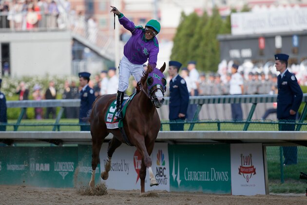 LOUISVILLE, KY - MAY 03:  Jockey Victor Espinoza celebrates atop of California Chrome #5 after crossing the finish line to win the 140th running of the Kentucky Derby at Churchill Downs on May 3, 2014 in Louisville, Kentucky.  (Photo by Kevin C. Cox/Getty Images)