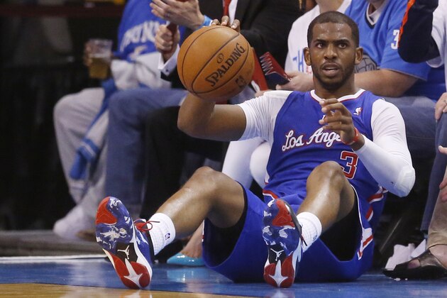Los Angeles Clippers guard Chris Paul (3) falls out of bounds with the ball in the second half of Game 5 of the Western Conference semifinal NBA basketball playoff series against the Oklahoma City Thunder in Oklahoma City, Tuesday, May 13, 2014. Oklahoma City won 105-104. (AP Photo)
