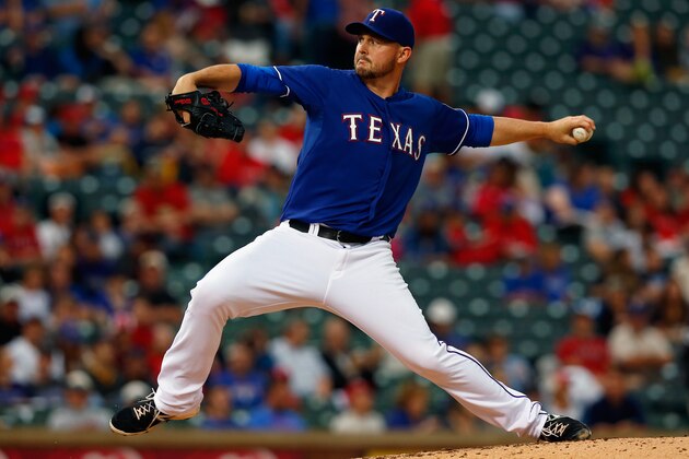 ARLINGTON, TX - MAY 08:  Matt Harrison #54 of the Texas Rangers pitches against the Colorado Rockies in the top of the third inning at Globe Life Park in Arlington on May 8, 2014 in Arlington, Texas.  (Photo by Tom Pennington/Getty Images)