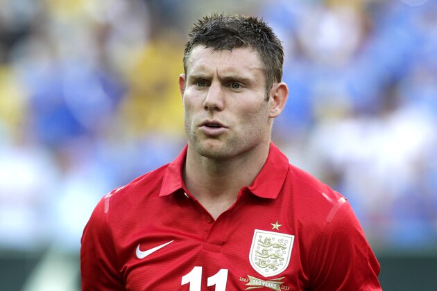 England's James Milner stands during the playing of the British national anthem before the start of an international soccer friendly against Brazil at the Maracana stadium in Rio de Janeiro, Brazil,  Sunday, June 2, 2013. (AP Photo/Victor R. Caivano)