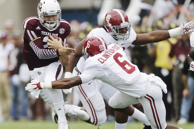 Texas A&M quarterback Johnny Manziel (2) is tackled by Alabama defensive back Ha Ha Clinton-Dix (6) during the first quarter of an NCAA college football game Saturday, Sept. 14, 2013 in College Station, Texas. (AP Photo/David J. Phillip)