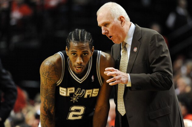 PORTLAND, OR - MAY 10: Gregg Popovich of the San Antonio Spurs has some words with Kawhi Leonard #2 of the San Antonio Spurs in the second half of Game Three of the Western Conference Semifinals against the Portland Trail Blazers during the 2014 NBA Playoffs at the Moda Center on May 10, 2014 in Portland, Oregon. The Spurs won the game 118-103. NOTE TO USER: User expressly acknowledges and agrees that, by downloading and or using this photograph, User is consenting to the terms and conditions of the Getty Images License Agreement. (Photo by Steve Dykes/Getty Images)