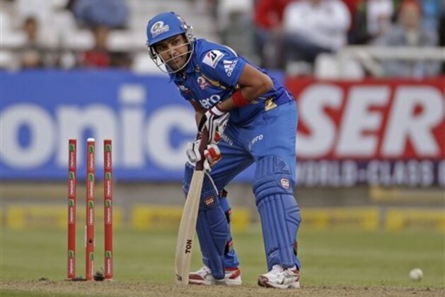 Mumbai Indians Rohit Sharma, looks up after the ball hit his wicket against Yorkshire during the Champions League Twenty20  in Cape Town, South Africa, Thursday, Oct 18, 2012. (AP Photo/Schalk van Zuydam)