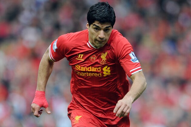 Liverpool's Luis Suarez during their English Premier League soccer match against Newcastle United at Anfield in Liverpool, England, Sunday May 11, 2014. (AP Photo/Clint Hughes)