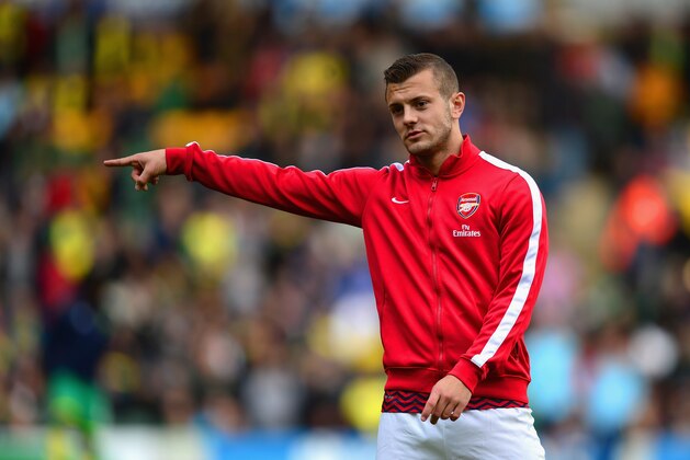 NORWICH, ENGLAND - MAY 11:  Jack Wilshere of Arsenal warms up ahead of  the Barclays Premier League match between Norwich City and Arsenal at Carrow Road on May 11, 2014 in Norwich, England.  (Photo by Jamie McDonald/Getty Images)