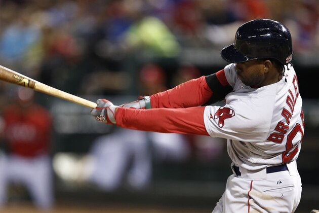 Boston Red Sox center fielder Jackie Bradley Jr. (25) follows through for a single against the Texas Rangers during the eighth inning of a baseball game, Saturday, May 10, 2014, in Arlington, Texas. (AP Photo/Jim Cowsert)