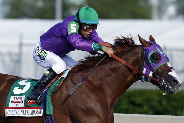 May 3, 2014; Louisville, KY, USA; Victor Espinoza aboard California Chrome (5) during the 2014 Kentucky Derby at Churchill Downs. Mandatory Credit: Brian Spurlock-USA TODAY Sports