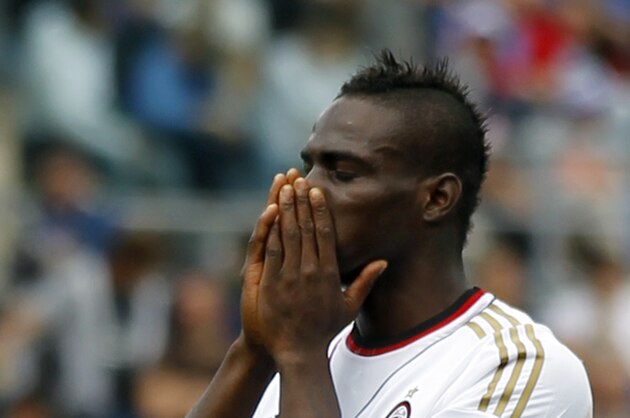 AC Milan's forward Mario Balotelli covers his face after missing a scoring chance during a Serie A soccer match against Atalanta in Bergamo, Italy, Sunday, May 11, 2014. Atalanta won 2-1. (AP Photo/Felice Calabro')