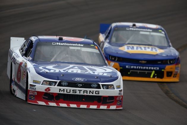 AVONDALE, AZ - MARCH 01:  Trevor Bayne, driver of the #6 AdvoCare Ford, leads Chase Elliott, driver of the #9 Napa Auto Parts Chevrolet, during the NASCAR Nationwide Series Blue Jeans Go Green 200 at Phoenix International Raceway on March 1, 2014 in Avondale, Arizona.  (Photo by Christian Petersen/Getty Images)