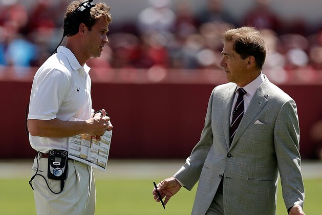 TUSCALOOSA, AL - APRIL 19:  Head coach Nick Saban of the Alabama Crimson Tide speaks with offensive coordinator Lane Kiffin during the Alabama A-Day spring game at Bryant-Denny Stadium on April 19, 2014 in Tuscaloosa, Alabama.  (Photo by Stacy Revere/Getty Images)
