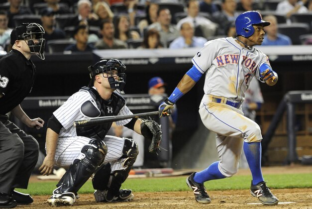 New York Yankees catcher Brian McCann watches New York Mets' Curtis Granderson (3) hit a two run home run off of New York Yankees starting pitcher Hiroki Kuroda in the sixth inning of an interleague baseball game at Yankee Stadium on Monday, May 12, 2014, in New York. (AP Photo/Kathy Kmonicek)