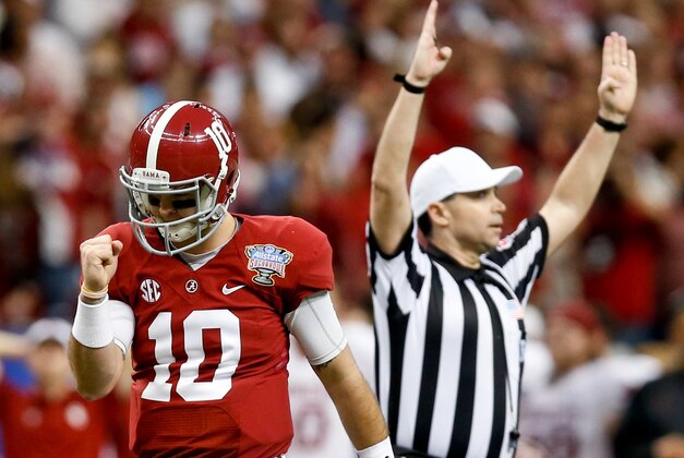 Jan 2, 2014; New Orleans, LA, USA;  Alabama Crimson Tide quarterback AJ McCarron (10) celebrates following a  touchdown run by running back Derrick Henry (not pictured) during the third quarter of a game against the Oklahoma Sooners at the Mercedes-Benz Superdome. Mandatory Credit: Derick E. Hingle-USA TODAY Sports
