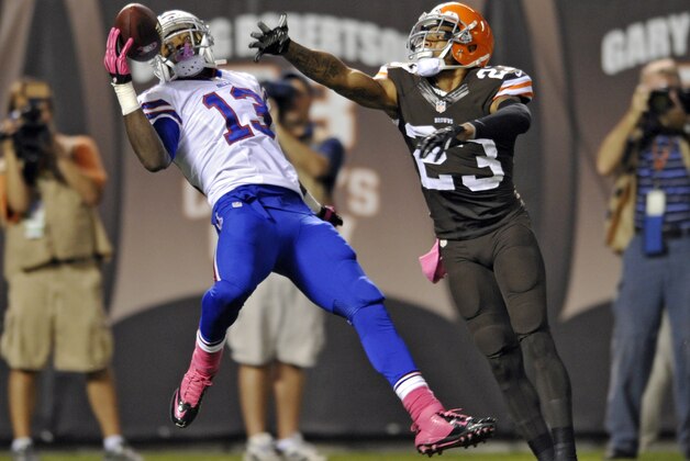 Cleveland Browns cornerback Joe Haden (23) breaks up a pass for Buffalo Bills wide receiver Stevie Johnson (13) but is called for pass interference in the first quarter of an NFL football game Thursday, Oct. 3, 2013, in Cleveland. (AP Photo/David Richard)