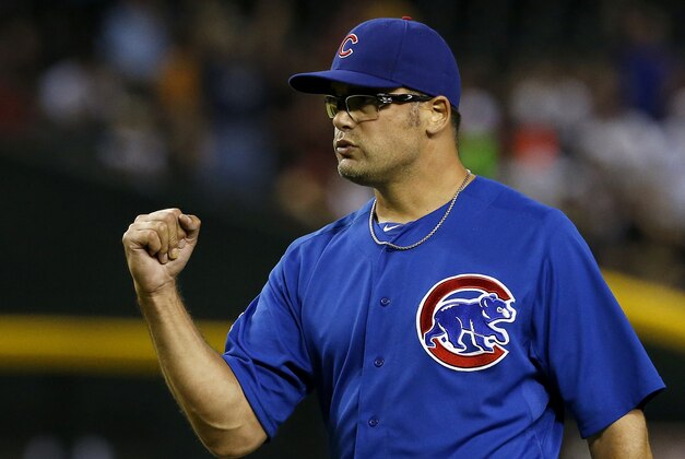 Chicago Cubs' Kevin Gregg pumps his fist after the final out against the Arizona Diamondbacks in the ninth inning of a baseball game on Monday, July 22, 2013, in Phoenix. (AP Photo/Ross D. Franklin)