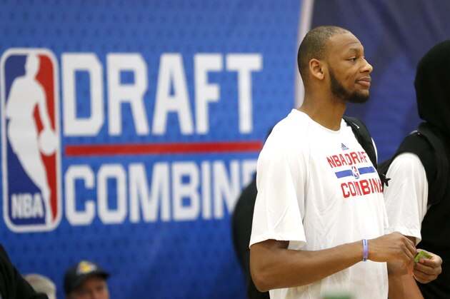Adreian Payne from Michigan State, left, and Aaron Gordon from Arizona, watch players participate in the 2014 NBA basketball Draft Combine Thursday, May 15, 2014, in Chicago. Payne is not scheduled to participate due to an illness. (AP Photo/Charles Rex Arbogast)