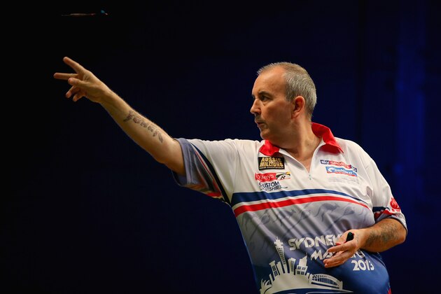 SYDNEY, AUSTRALIA - AUGUST 30:  Phil Taylor of England in action during his quarter-final match against Paul Nicholson of England during day two of the Sydney Darts Masters at Luna Park on August 30, 2013 in Sydney, Australia.  (Photo by Mark Kolbe/Getty Images)