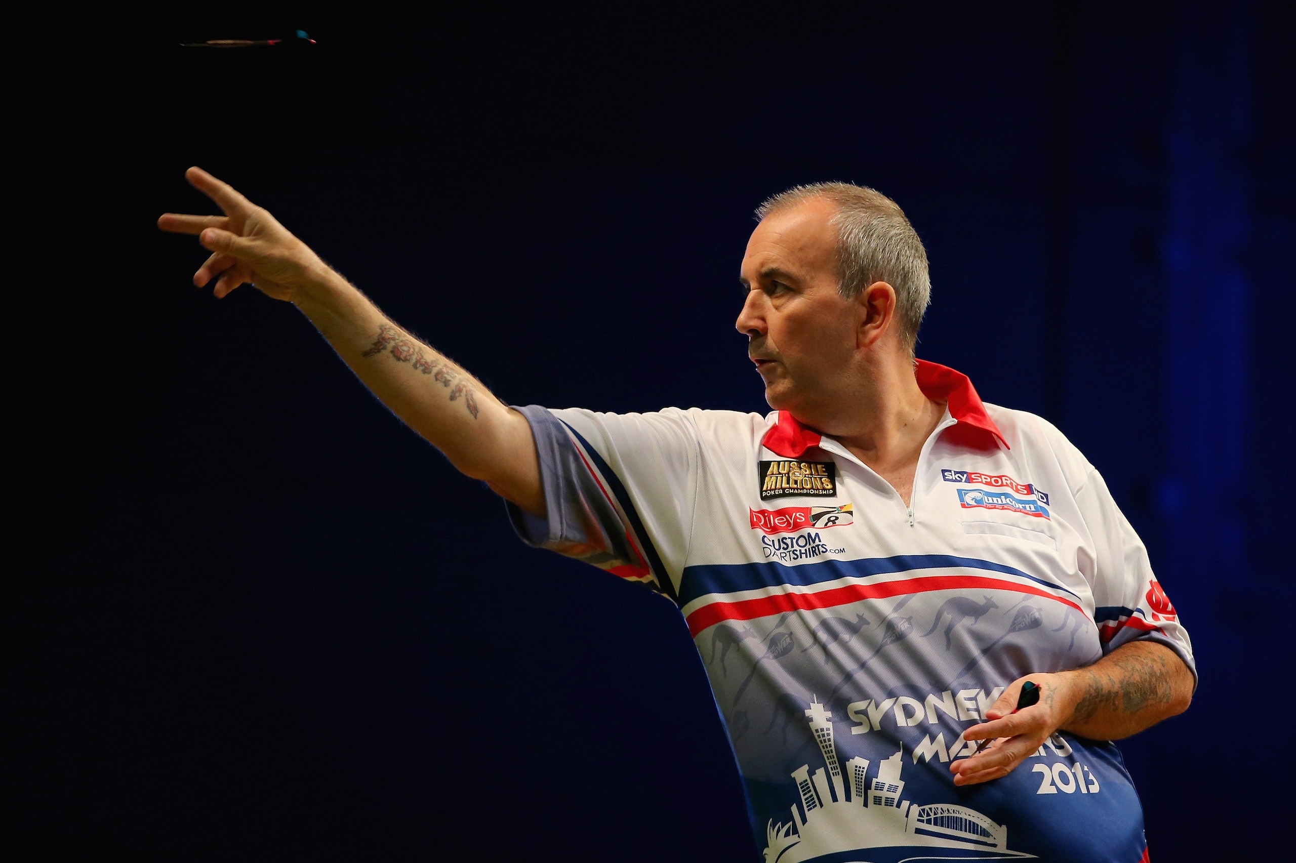 SYDNEY, AUSTRALIA - AUGUST 30:  Phil Taylor of England in action during his quarter-final match against Paul Nicholson of England during day two of the Sydney Darts Masters at Luna Park on August 30, 2013 in Sydney, Australia.  (Photo by Mark Kolbe/Getty Images)