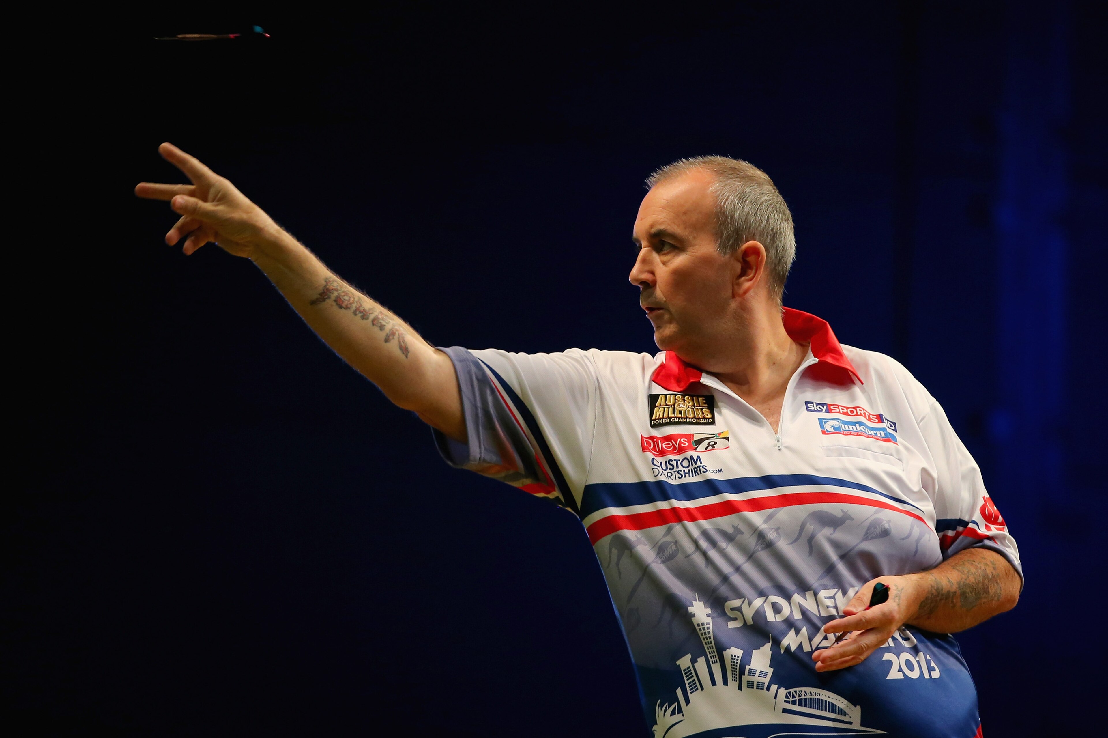 SYDNEY, AUSTRALIA - AUGUST 30:  Phil Taylor of England in action during his quarter-final match against Paul Nicholson of England during day two of the Sydney Darts Masters at Luna Park on August 30, 2013 in Sydney, Australia.  (Photo by Mark Kolbe/Getty Images)