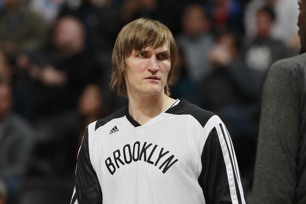 Brooklyn Nets forward Andrei Kirilenko, of Russia, looks on againsst the Denver Nuggets in the third quarter of the Nets' 112-89 victory in an NBA basketball game in Denver on Thursday, Feb. 27, 2014. (AP Photo/David Zalubowski)