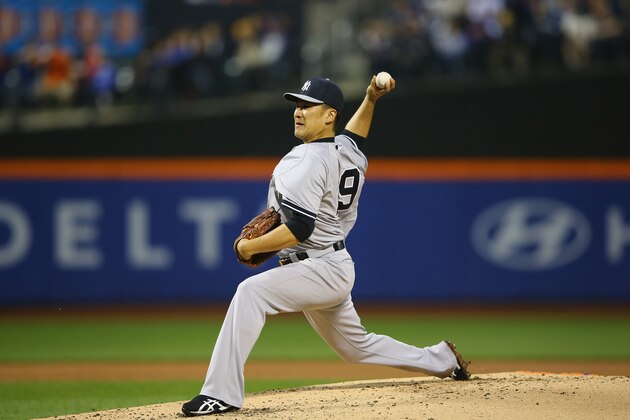 NEW YORK, NY - MAY 14:  Masahiro Tanaka #19 of the New York Yankees pitches against the New York Mets during their game on May 14, 2014 at Citi Field in the Flushing neighborhood of the Queens borough of New York City.  (Photo by Al Bello/Getty Images)