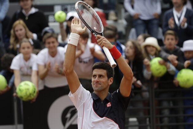 Novak Djokovic celebrates after beating Radek Stepanek at the Italian Open tennis tournament, in Rome, Tuesday, May 13, 2014. Djokovic won 6-3, 7-5. (AP Photo/Alessandra Tarantino)