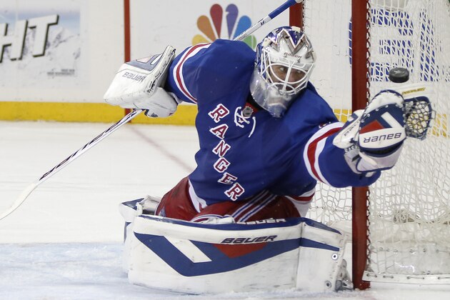 New York Rangers goalie Henrik Lundqvist (30) of Sweden makes a save in the third period of Game 6 of an NHL hockey second-round hockey playoff series against the Pittsburgh Penguins, Sunday, May 11, 2014, in New York. The Rangers defeated the Penguins 3-1 to tie the series at 3 games a piece. (AP Photo/Kathy Willens)