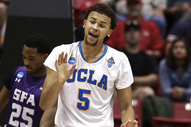 UCLA's Kyle Anderson urges on his team during the second half of a third-round game against Stephen F. Austin in the NCAA college basketball tournament, Sunday, March 23, 2014, in San Diego. (AP Photo/Gregory Bull)