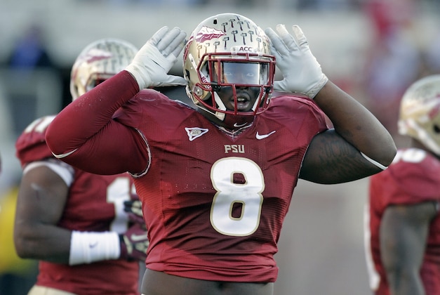 Florida State defensive tackle Timmy Jernigan gestures to the fans to get loud during the first half of an NCAA college football game against Florida, Saturday, Nov. 24, 2012, in Tallahassee, Fla. (AP Photo/John Raoux)